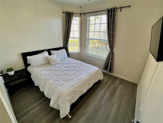 bedroom featuring dark wood-type flooring