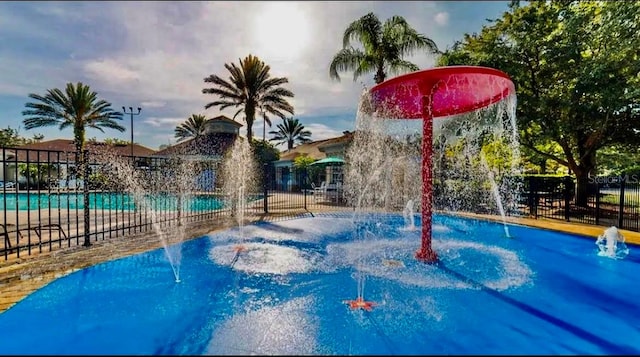 exterior space with pool water feature