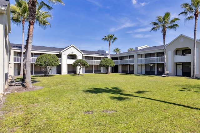 view of yard with a balcony