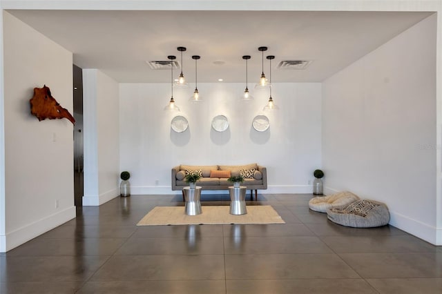 interior space featuring dark tile floors