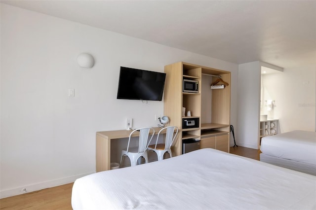 bedroom featuring light wood-type flooring