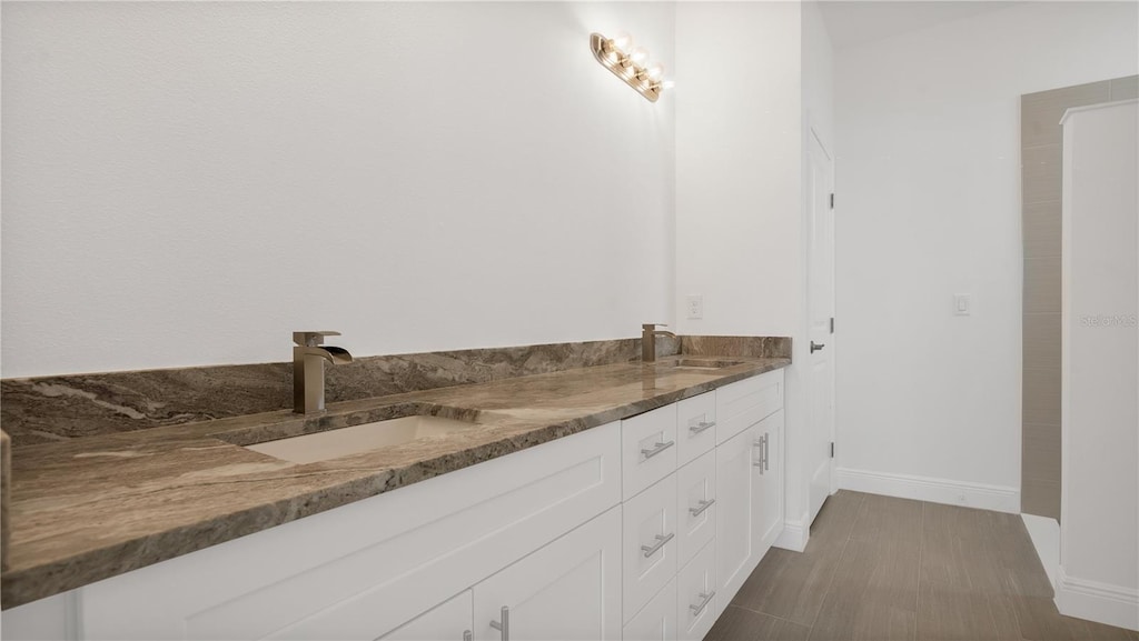 bathroom with dual vanity