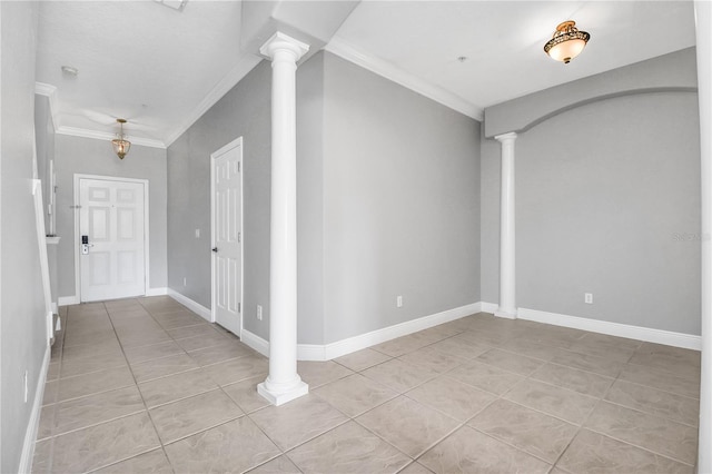 interior space with crown molding and decorative columns