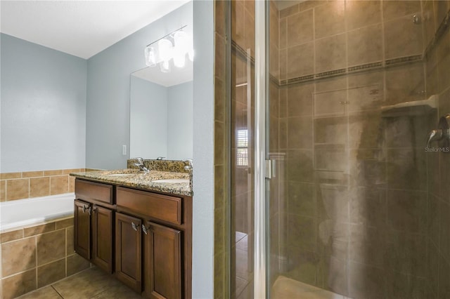 bathroom with oversized vanity, separate shower and tub, and tile flooring