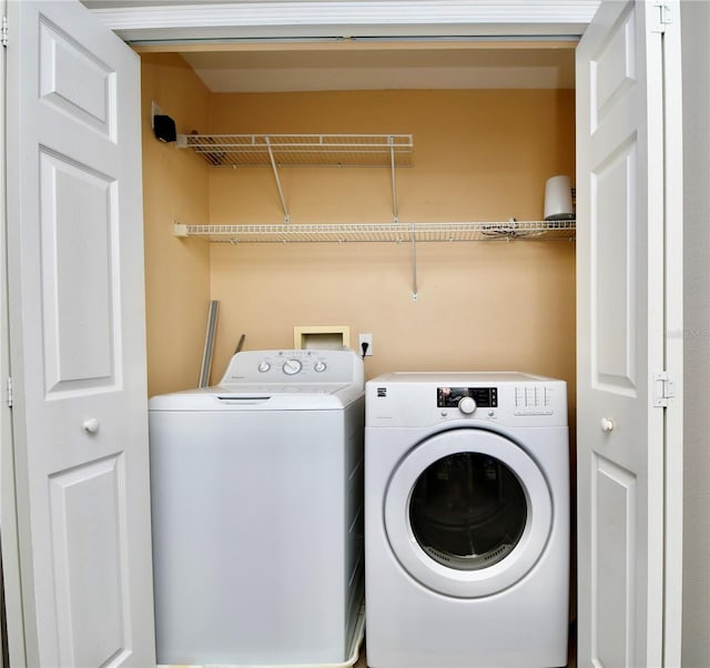 laundry area with separate washer and dryer