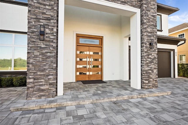 entrance to property featuring a garage