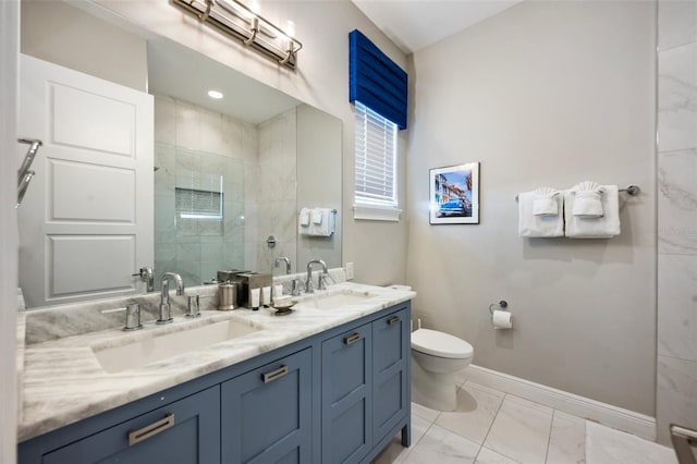 bathroom with toilet, dual sinks, large vanity, and tile flooring