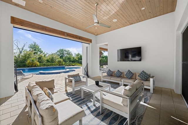 view of terrace with an outdoor hangout area and ceiling fan