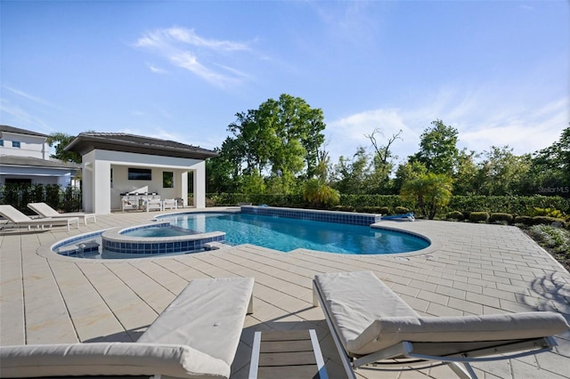 view of swimming pool featuring a patio area