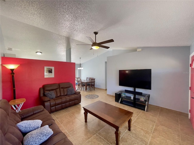 tiled living room featuring vaulted ceiling, a textured ceiling, and ceiling fan