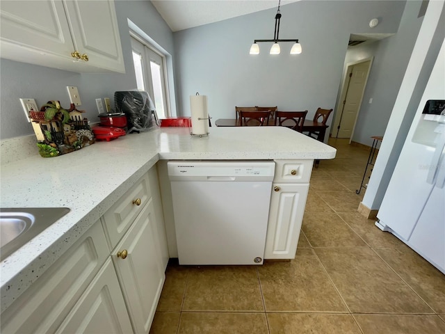 kitchen with white dishwasher, pendant lighting, light tile flooring, vaulted ceiling, and white cabinets