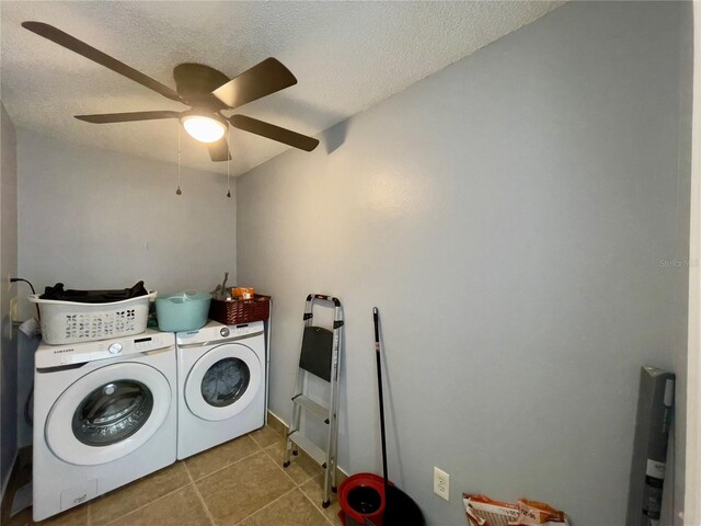 laundry room featuring light tile floors, a textured ceiling, ceiling fan, and washing machine and dryer