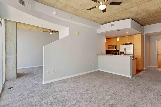 unfurnished living room with light carpet and ceiling fan