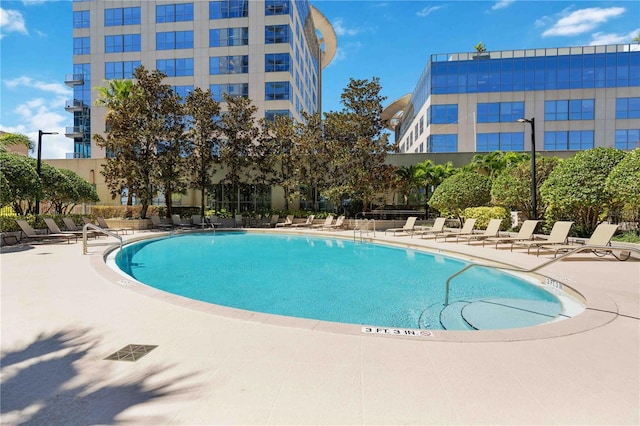 view of swimming pool featuring a patio area