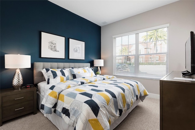 bedroom featuring light carpet