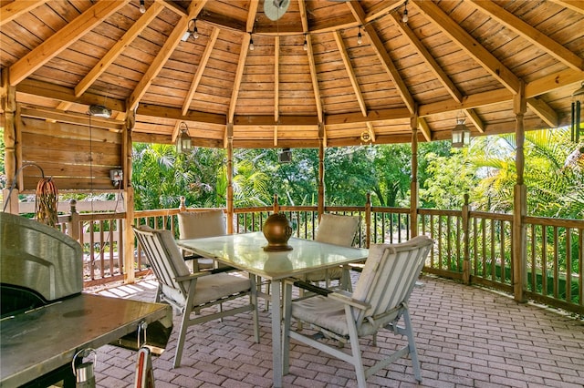 unfurnished sunroom with lofted ceiling with beams and wood ceiling