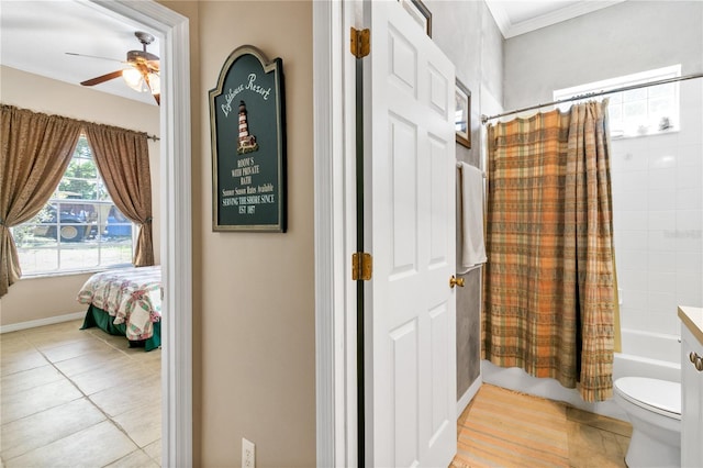 full bath featuring a ceiling fan, toilet, shower / bath combo with shower curtain, crown molding, and vanity