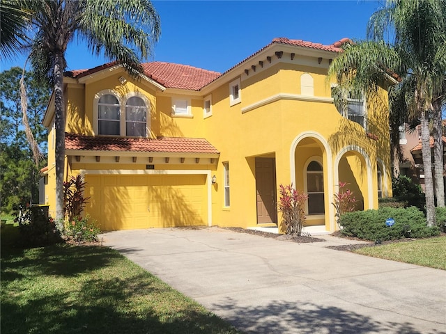 mediterranean / spanish-style home featuring a garage