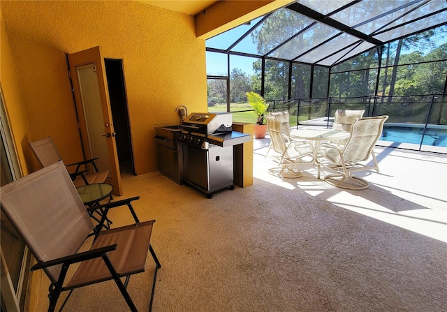 view of patio / terrace with glass enclosure and area for grilling