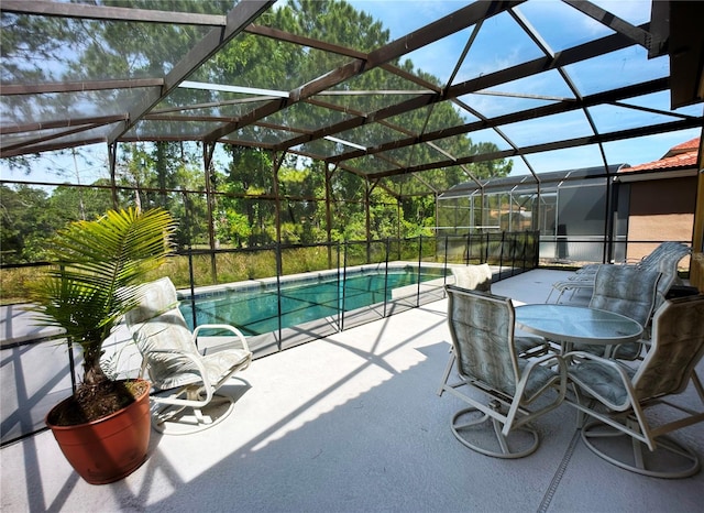 view of patio with glass enclosure