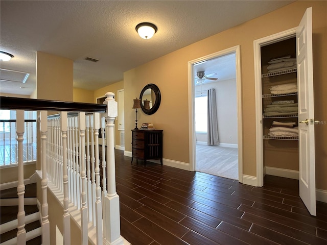 corridor with a textured ceiling