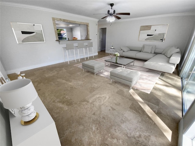 living room featuring ceiling fan and ornamental molding