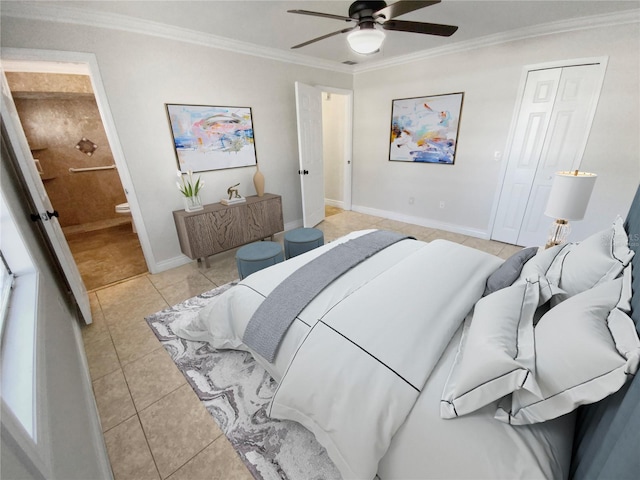 bedroom featuring ensuite bath, ceiling fan, light tile patterned floors, and ornamental molding