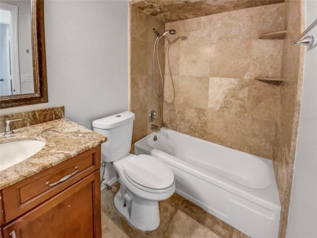 full bathroom featuring vanity, toilet, and tiled shower / bath combo