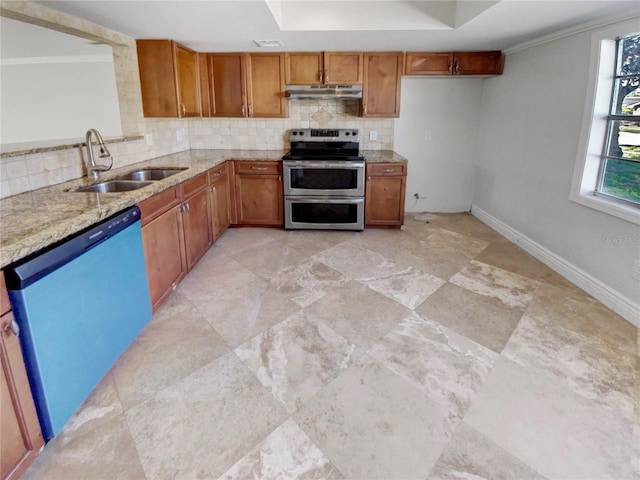 kitchen with light stone countertops, backsplash, stainless steel appliances, crown molding, and sink