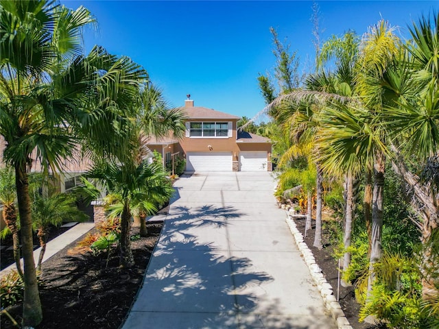 view of front of property with a garage