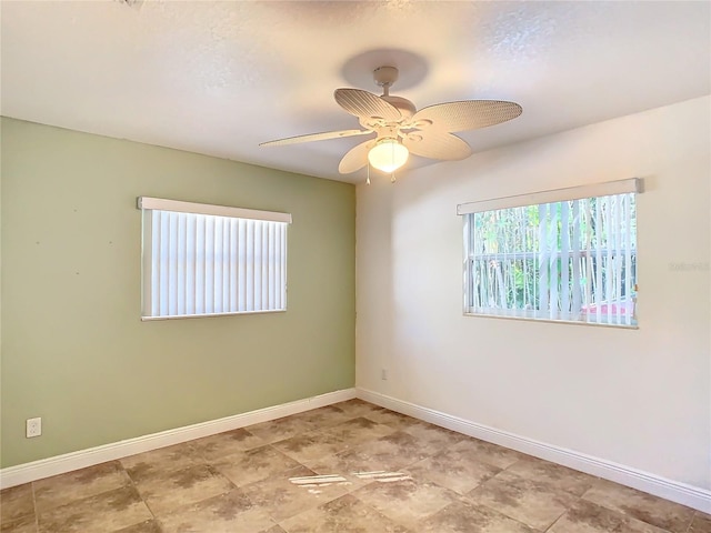 empty room featuring ceiling fan