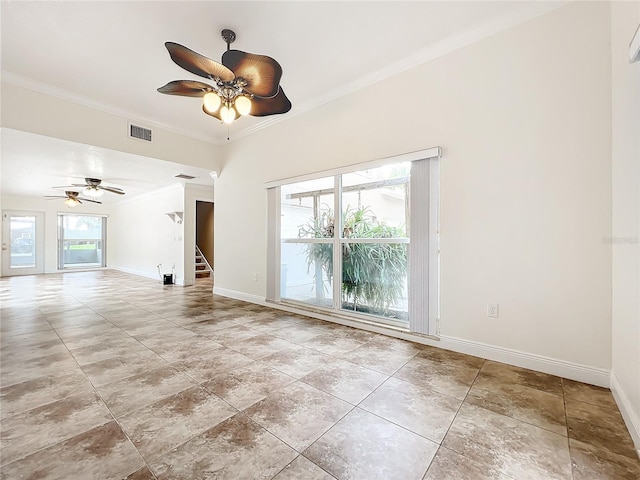 empty room with ceiling fan and crown molding