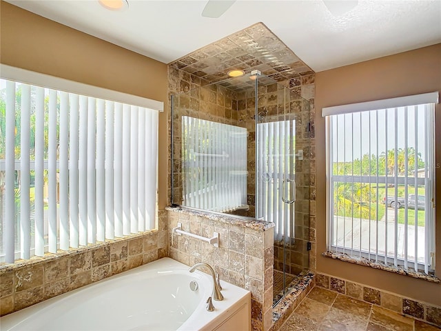 bathroom with shower with separate bathtub