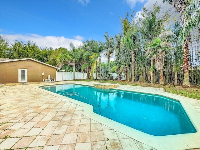 view of swimming pool with a patio area