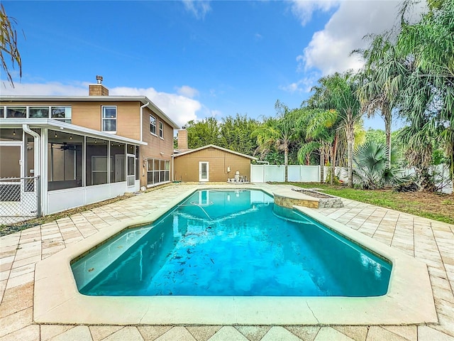 view of pool featuring a patio and a sunroom