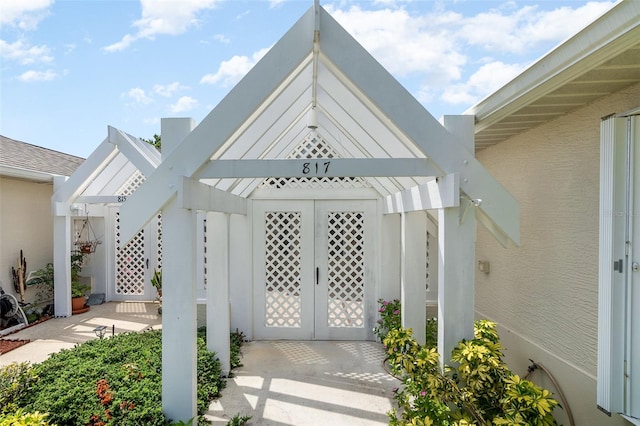 property entrance featuring french doors