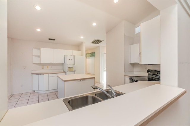 kitchen with sink, electric range, white cabinets, white refrigerator with ice dispenser, and a center island