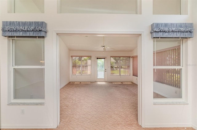 interior space featuring ceiling fan