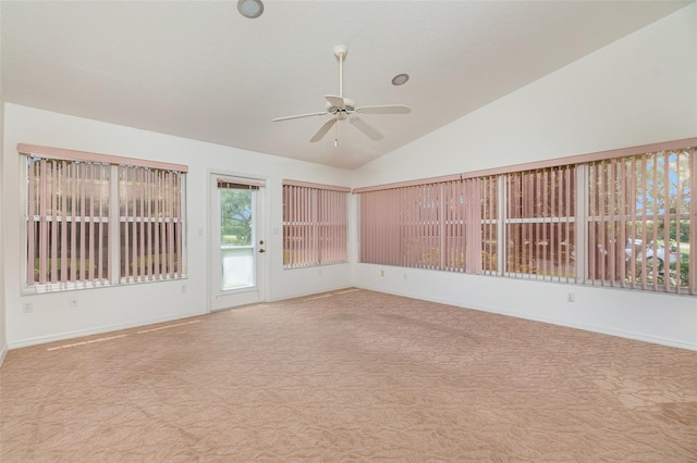 unfurnished room with high vaulted ceiling, ceiling fan, and light colored carpet