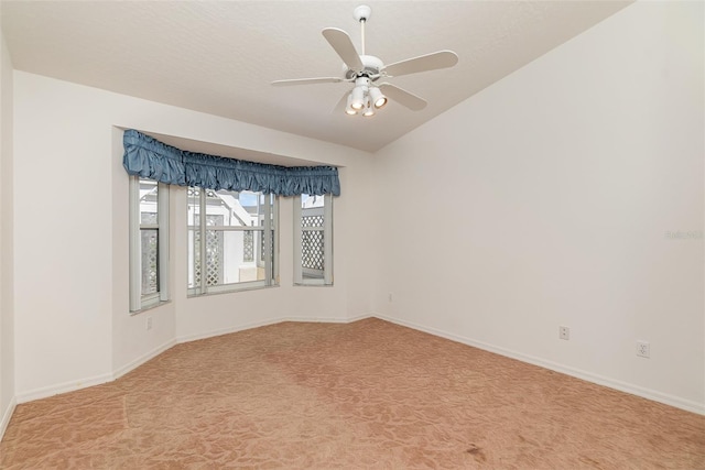 empty room with light colored carpet and ceiling fan