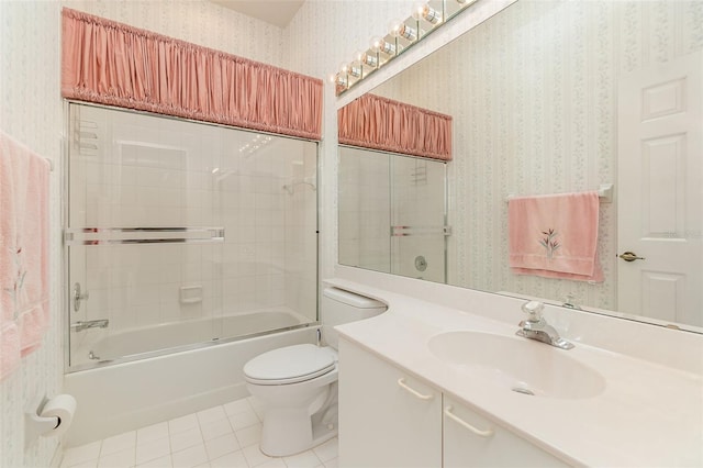 full bathroom featuring tiled shower / bath, toilet, tile flooring, and oversized vanity