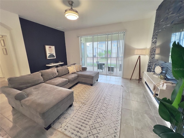 living room with visible vents and light tile patterned floors