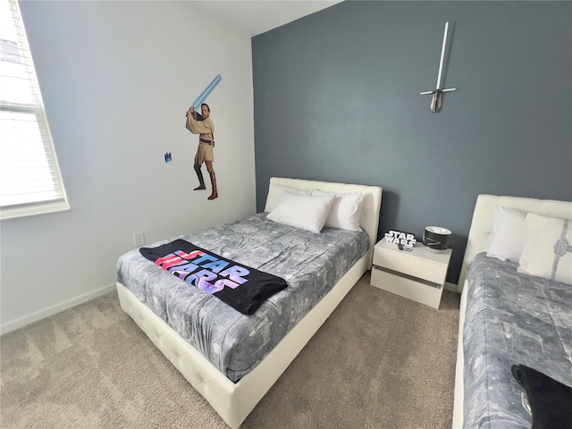 bedroom with carpet and baseboards