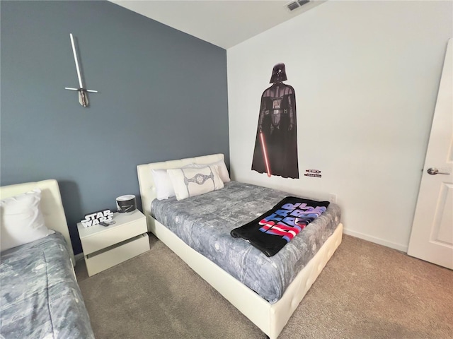 carpeted bedroom featuring baseboards