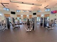 workout area with a high ceiling and plenty of natural light