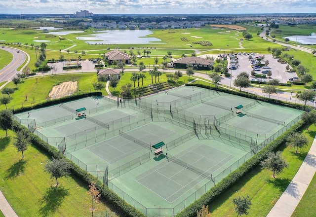 birds eye view of property featuring a water view and golf course view