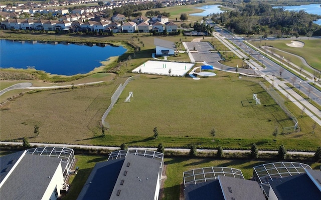 birds eye view of property featuring a residential view and a water view