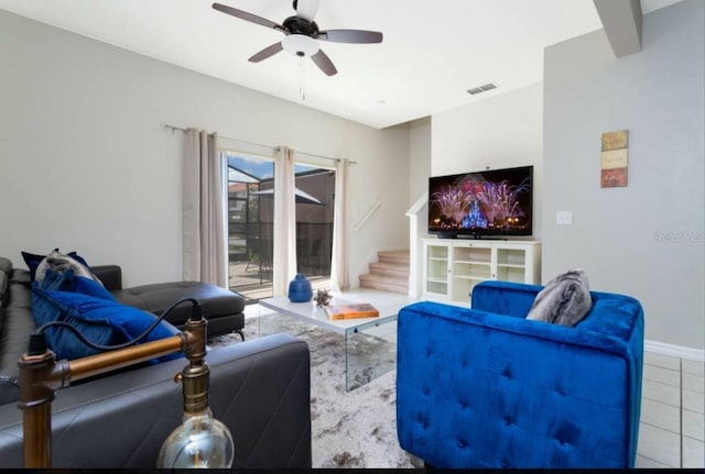 living room with light tile flooring and ceiling fan