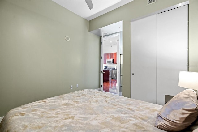 bedroom featuring hardwood / wood-style floors and ceiling fan