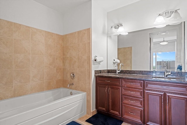 bathroom featuring tiled shower / bath combo, double sink, tile flooring, and oversized vanity